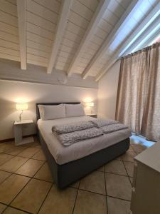Postel nebo postele na pokoji v ubytování Lakecomoweb Apartments