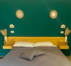 Postel nebo postele na pokoji v ubytování Hotel Villa Pozzi