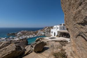 a view of a building on the side of a mountain at Villa Roccia - MG Villas Mykonos in Mýkonos City