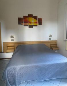 Postel nebo postele na pokoji v ubytování Hotel Villa Pozzi