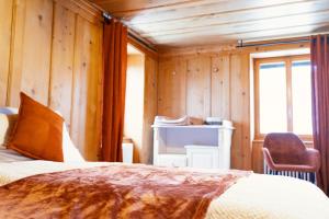 Letto o letti in una camera di Maison Gruyère avec Cheminée et Vue sur les Alpes