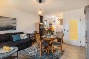 a living room with a couch and a table at Marla in Lauterbach