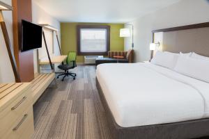 a hotel room with a bed and a television at Holiday Inn Express & Suites Pahrump, an IHG Hotel in Pahrump