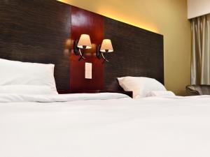 South China Sea Place by Kinabina Homestay客房内的一张或多张床位