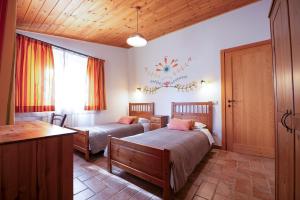 Postel nebo postele na pokoji v ubytování Agriturismo Fattoria Walden