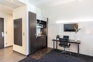 TV a/nebo společenská místnost v ubytování Garner Hotel Berlin - Mitte by IHG