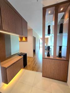 a large room with a room with vases on shelves at Urban Escape family friendly 5 or 6 pax in Kuching