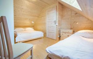 Ένα ή περισσότερα κρεβάτια σε δωμάτιο στο Nice Home In Pobierowo With Wifi +4 φωτογραφίες