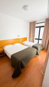 Postel nebo postele na pokoji v ubytování Hotel Mar Azul