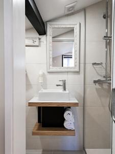 a bathroom with a sink and a mirror at Casa Recanto do Teatro in Lamego +84 photos