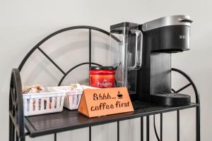 a coffee maker on a shelf with a box at Touch Of Jazz-workspace 300mbps Wifi in Clarksville