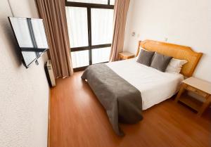 Postel nebo postele na pokoji v ubytování Hotel Mar Azul