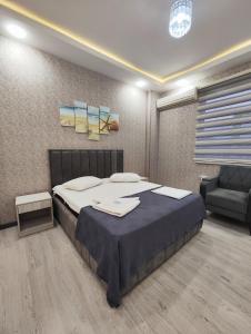 Postel nebo postele na pokoji v ubytování Gemi Hotel