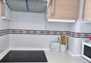 Kuchyň nebo kuchyňský kout v ubytování Apartamentos Arcos Céntrico