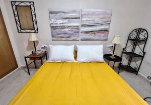 Postel nebo postele na pokoji v ubytování Apartamentos Arcos Céntrico