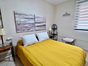 Postel nebo postele na pokoji v ubytování Apartamentos Arcos Céntrico