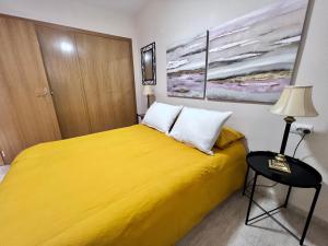 Postel nebo postele na pokoji v ubytování Apartamentos Arcos Céntrico