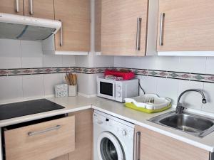 Kuchyň nebo kuchyňský kout v ubytování Apartamentos Arcos Céntrico