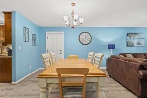 a dining room with a table and a couch at Dry Dock 101 in Myrtle Beach
