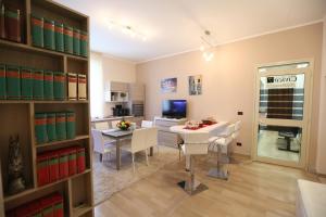 a kitchen and dining room with a table and chairs at Civico7 in Villa San Giovanni