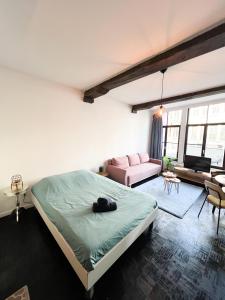 Postel nebo postele na pokoji v ubytování Rustieke studio in hartje antwerpen
