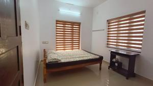 Postel nebo postele na pokoji v ubytování Mom's Villa