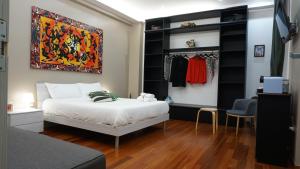 a bedroom with a bed and a closet at L'Aurora B&B in Salerno