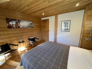 Posteľ alebo postele v izbe v ubytovaní Chalet les 3 cerfs