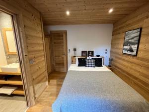 Posteľ alebo postele v izbe v ubytovaní Chalet les 3 cerfs