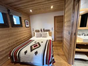 Posteľ alebo postele v izbe v ubytovaní Chalet les 3 cerfs