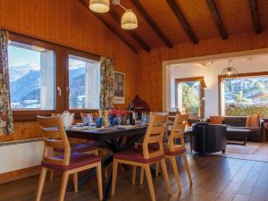 a dining room with a table and chairs at Chalet Beke by Interhome in Nendaz