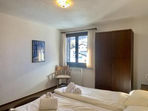Postel nebo postele na pokoji v ubytování Apartment Residenza Chesa Margun 15-6 by Interhome + 17 fotografií