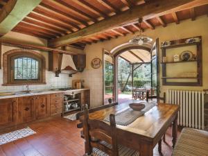 a kitchen with a wooden table in a room at Holiday Home Desideri by Interhome in Fornello