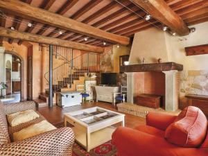 a living room filled with furniture and a fireplace at Holiday Home Desideri by Interhome in Fornello