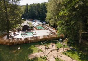 an aerial view of a playground with a pool at Huttopia Vallée de la Semois in Vresse-sur-Semois
