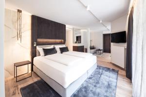 Postel nebo postele na pokoji v ubytování Hotel Prokulus - Family & Wellness