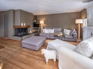 a living room with two couches and a fireplace at Apartment Schweizerhof 221 by Interhome in Lenzerheide