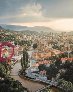 a view of a city with a river at La Vita E Bella in Sarajevo