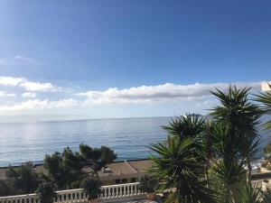 a view of the ocean from the balcony of a resort at Casamea - Villa, Piscine, Vue Mer, Sanguinaires in Ajaccio