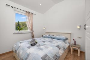 a bedroom with a bed and a window at Villa Antonia in Zagorje +14 photos