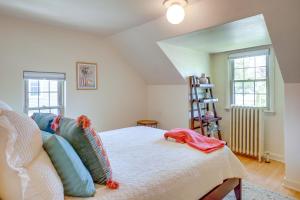 a bedroom with a bed with pillows on it at Walkable Thiensville Retreat Near Hiking! in Thiensville