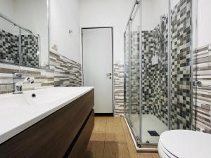 a bathroom with a toilet and a sink and a shower at Le Dimore del Corso in Catania