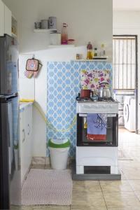 a kitchen with a stove with a pot on it at Departamento sobre Av San Jose in Ciudad del Este