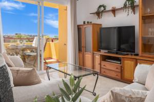 TV a/nebo společenská místnost v ubytování Tu Oasis En Malaga Con Playa