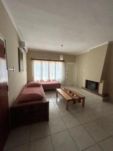 a bedroom with a bed and a table in it at Casa catamarca in San Rafael
