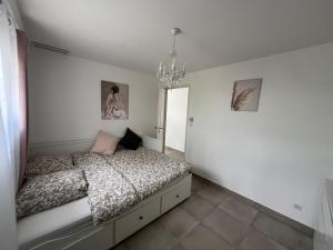 Postel nebo postele na pokoji v ubytování Chambres & Suites Villa architecte