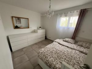 Postel nebo postele na pokoji v ubytování Chambres & Suites Villa architecte