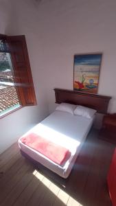 Postelja oz. postelje v sobi nastanitve La Oculta Hostal