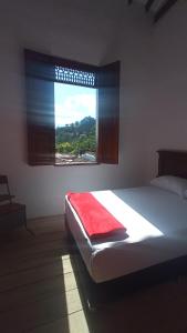 Postelja oz. postelje v sobi nastanitve La Oculta Hostal