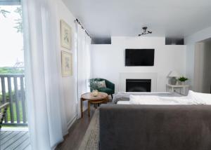 a bedroom with two beds and a fireplace at Stunning Riverfront Getaway in Downtown Nashville in Nashville